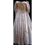 An 'Alona' silk wedding gown with fitted bodice and full skirt (size unknown but possibly 12/14)