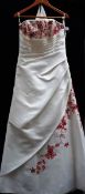 A 'Forever Yours' ivory wedding gown with contrasting with red embroidery and train, size 16,
