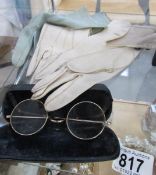 A quantity of vintage gloves and a pair of vintage spectacles