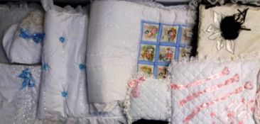A variety of small decorative quilts and pillows