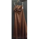 A brown with pink trim 'Forever Yours' full length empire style evening gown with matching bag,