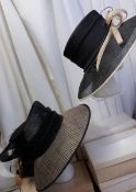 2 large brimmed black and ecru hats