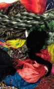 A large assortment of scarves,