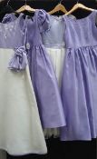 A lavender and white bridesmaid dress with bow detail (age 8),