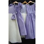 A lavender and white bridesmaid dress with bow detail (age 8),