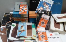A quantity of vintage stockings and tights plus boxes
