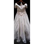 An ivory 'Mon Cher Bridal Inc' gown with decorative bodice and full skirt with train,