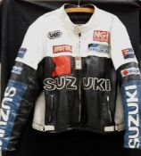 A vintage Suzuki racing motorcycle leather jacket with zip front and patches
