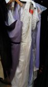 A large collection of evening and wedding gowns,