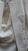 A cream embroidered bridal suit comprising jacket and skirt,