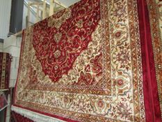 A red ground Keshaw carpet,