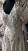 An Alfred Angelis bridal gown with beaded bodice with full skirt (no size listed)