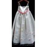 A 'Forever Young' white flower girl dress with pink sash, appliqued flowers and embriodery,