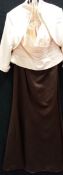 A 'Forever Yours' gown with cream bodice, brown skirt and cream jacket and a small evening bag,