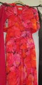 A multi coloured floral evening gown with matching jacket,