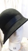 A small black brimmed felt hat