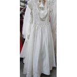 An ivory bridal gown "Forever Yours" with embroidered bodice and detachable embroidered train,