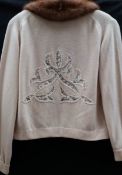 A vintage cashmere cardigan by De Loux trimmed with beige mink and open work detail to front and
