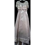 An old gold empire line wedding gown with beaded bodice and train,