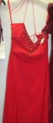 A long red evening gown with beaded bodice,
