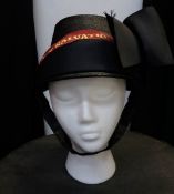 A vintage Salvation Army hat with sash and bow detail