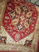 A red ground Heriz carpet,