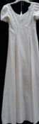 A 'Margaret Lee' ivory bridal gown (no size)