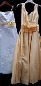 2 girls party/prom/bridesmaid dresses, 1 yellow and 1 white with yellow tie,