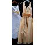 2 girls party/prom/bridesmaid dresses, 1 yellow and 1 white with yellow tie,