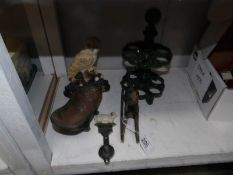 A mixed lot of cast iron items including door stop