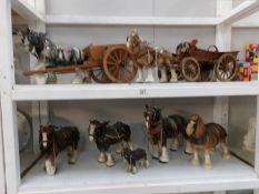 2 shelves of ceramic shire horses