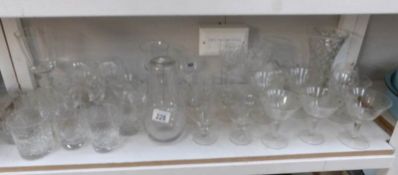 A shelf of glass ware