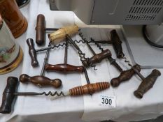 11 Victorian and Edwardian cork screws including some with brushes missing