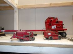 A tin plate crane and 3 Dinky toys,