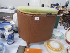 A wicker linen stool