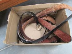 A box of leather belts