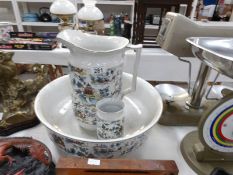 An oriental style jug and basin set,