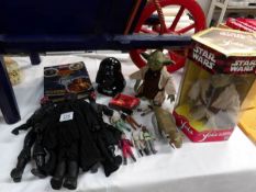 A quantity of Star Wars figures and collectables