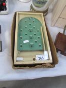 A small vintage bagatelle game