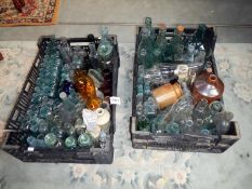 2 trays of glass bottles,