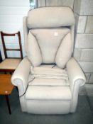 An electric reclining armchair