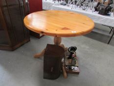 A circular pine kitchen table