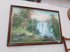 An oil on canvas of a waterfall signed R Dentford