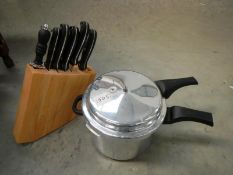 A pressure cooker & knife set in block