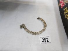 A yellow metal bracelet