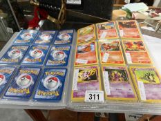 A collection of Pokemon cards in folder