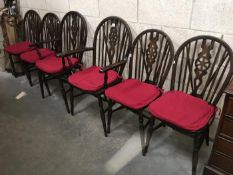 A set of 6 wheel back chairs