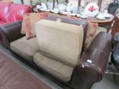 A good quality sofa with matching stool and cushions