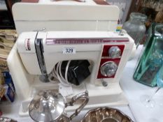 A New Home cased sewing machine