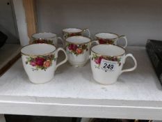 6 Rose decorated mugs including Royal Albert